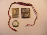 His father's mementos from the World War I: a Russian tricolour flag, a field icon and the Longines watch
