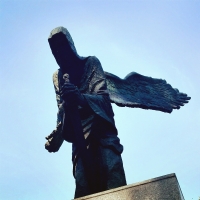 Angel of Death with a sword with a Soviet star on the monument to the victims of the Katyn massacre in Wroclaw