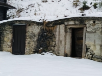cellars in the hillside where people hid during the fire