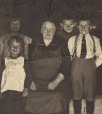 Grandmother Anna Jůvová (1868-1956), on the left Božena, on the right cousins Zdeněk and Václav, circa 1933