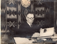 Zubrytskyi Mykhailo Mykolayovych, the narrator's grandfather, while working in his office.

