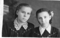 Zubrytski sisters (from left to right: Daria, Sofiya) in Siberia in school uniform, you can see embroidered flowers their mother sewed on for them on school uniform, January 1953. 

