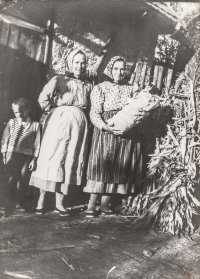 Their neighbour Klepáčková and on the right wife's mother Marie Hrůzová, who is holding Rachel Hrůzová in her arms