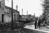 Destroyed houses in Hrabyně, church on the right, road leading to the cemetery, 1945