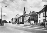 The road to Ostrava, on the right the Hrabyně church, school, Jednota pub and Onderek's house, 1965