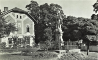 Hrabyně rectory built in 1908, in front of it a statue of St. Anne, on the right behind the trees a castle, 1932
