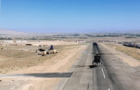 Landing at the base, on the left Hercules civilian material carrier after the 2010 crash