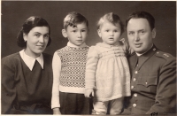 With his mother, sister and father, 1945