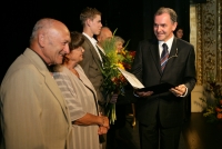 Jaroslav Smutný and his wife Vlasta receiving the award from the regional council president of the South Moravian Region Stanislav Juránek. Brno, 2006.