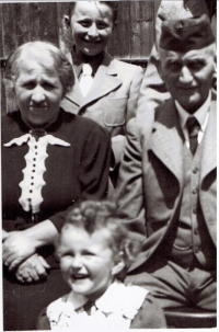 photo from the saved album - Lýdia Ferová with her grandparents, in the backround cousin Miki Hoff