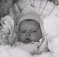 As a newborn, 1957