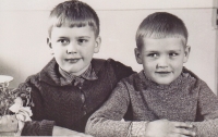 As a child with his brother Roman, the witness in the photo on the left