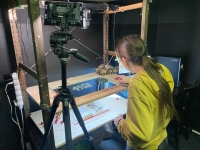 Laura prepares an animation scene with her props