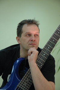 Radovan Kaplan posing with guitar