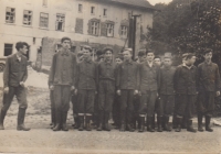 Arrival in front of the dormitory in Vrchlabí, Fr. Drápala is 4th from the left in the 1st row