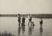 Family bathing in a pond. 1927