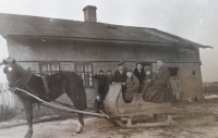 At his family home in Požděnice near Zelów during the visit of his father from the front, Karel with his father and family on a sledge in 1943 
