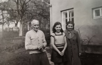 Ludmila Koštejnová with her parents in Sokol costume, 1948