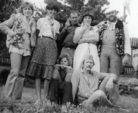 At Kamýk, private event of a group of friends, Dancing on the draff, the witness first from the left, husband Jiří sitting on the ground, 1981