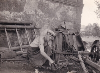 Miroslava's dad repairing farm tools (1960s)