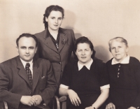 The Konečný family; father, mother, grandmother, Alena, standing. 1948