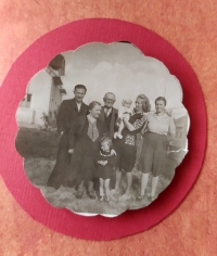 Natalija with her parents, grandparents and younger brother in front of their house in Kranj, Slovenia (in wartime)