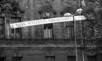 Jiří Dohnal removing communist banners in Olomouc, November 1989