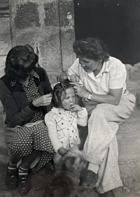 Aunt Alice, right, coming to visit from New York, mother Hana and Vera, probably picking lice, Latacunga 1946