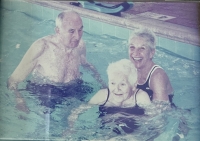 Vera with the parents in a swimming pool, 2002