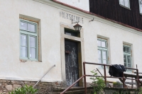 Entrance to the former school in Kačerov, July 2022
