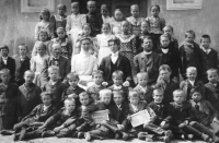In the bottom row, the first one from the left, lies the future Baptist preacher Cyril Burget, year 1906, village Lipová in Prostějov district
