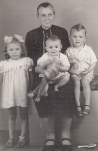 Věra (left) with her grandmother Pauková and siblings Eva and Ladislav, 1947