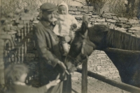 Jiří Nachtigall as a child in the 1940s on the family farm, with father
