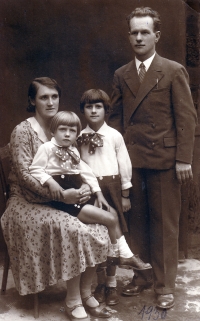 With her parents and youger brother, 1930