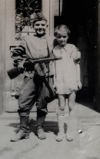 Dagmar with a Russian orphan, who was shot by a sniper, 1945 