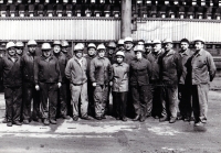 Marie Voznicová (the smallest figure in the middle) with the team of the locksmith workshop in the coking plant in Karviná / 1970s

