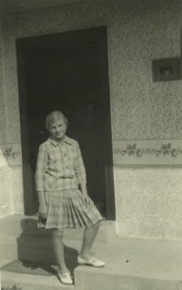 Božena Beňová in front of her family house in Jenkovce (first half of the fifties) 