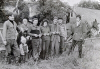 Helena Geršlová with her family pickings sloes in the meadows above Sidonia - on the far right is her brother František, the man in the hat is her father, and she is standing to his left along with her husband, early 1970s