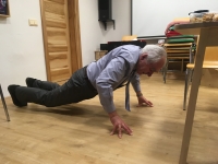 Jan Suchánek performs push-ups in the studio after filming

