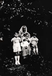Grandmother Marie Krausová and Karolina Remiášová with brothers Norbert and Alfred in the monastery garden