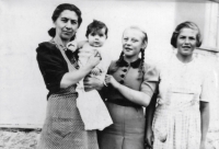 Autumn 1940, Erika in her mother's arms, two nannies on the right

