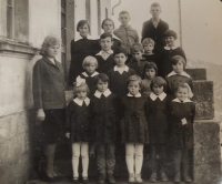 The witness (the first one from the right in the first row) in school in Pstrążné 