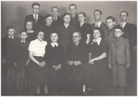 Family photo of the Diviš family (bottom row in the middle: his grandfather Vilém and grandmother Anna, his sister Marie is next to his grandmother, his father Josef is above Marie, far left his brother František, Petr is above the grandmother, his sister Vilma is above the grandparents, his daughter Lidka is next to them), 1957
