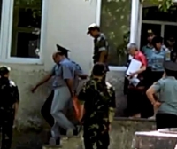 Escorted out of the courtroom, 4 August 2015