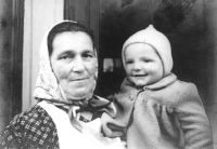A childhood photograph of Jaroslav Novák with his grandmother Františka, 1947