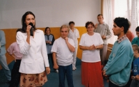 Eva Ludvíčková in a red skirt on the right with clients of the Domov Naděje (Home of Hope), 1998