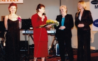 Eva Ludvíčková with the microphone, presentation of the Quality Award in the Upper House of the Czech Republic, Prague 2005