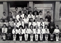 Jana Černá (seated, fourth from right) and her classmates wearing the Pionýr youth organisation uniform