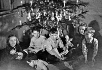 Václav Kaňka with his brother and cousins by the Christmas tree (1950)		
