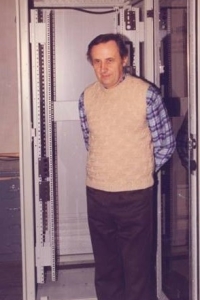 Karel Soukup in front of a new type of distribution board for data and optical cables, which he himself developed in 1995